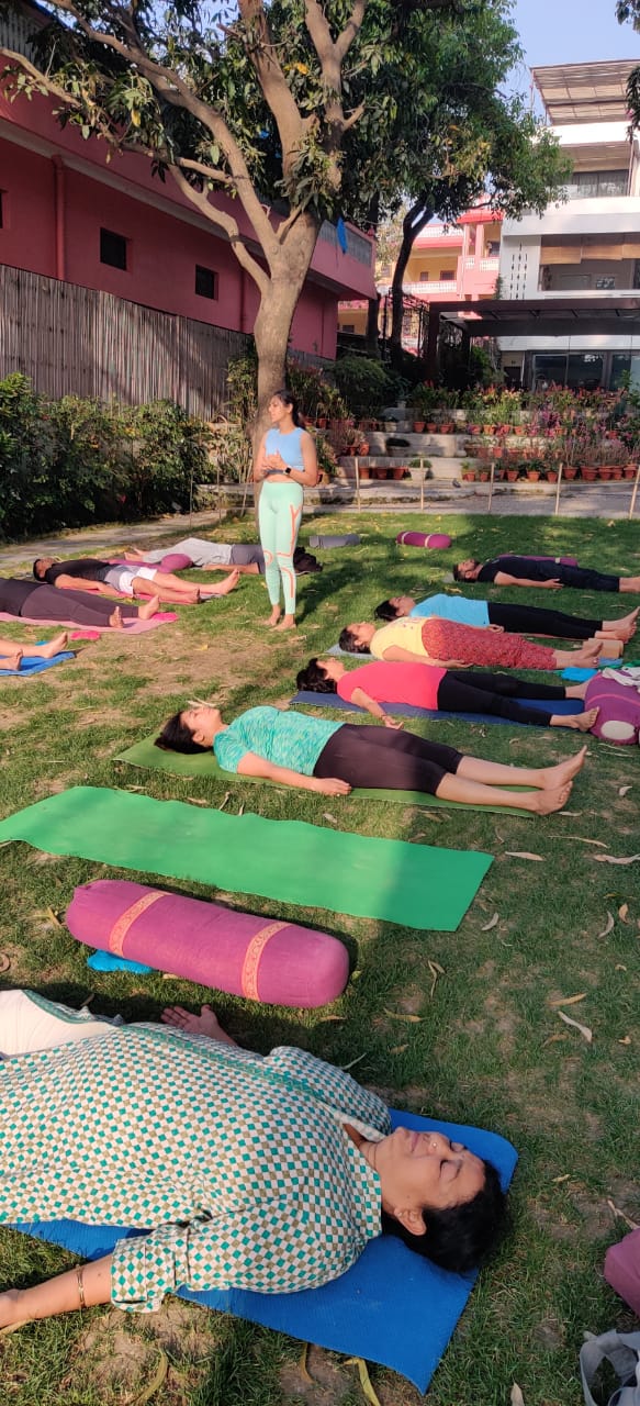 Rishika leading outdoor yoga therapy at a past retreat